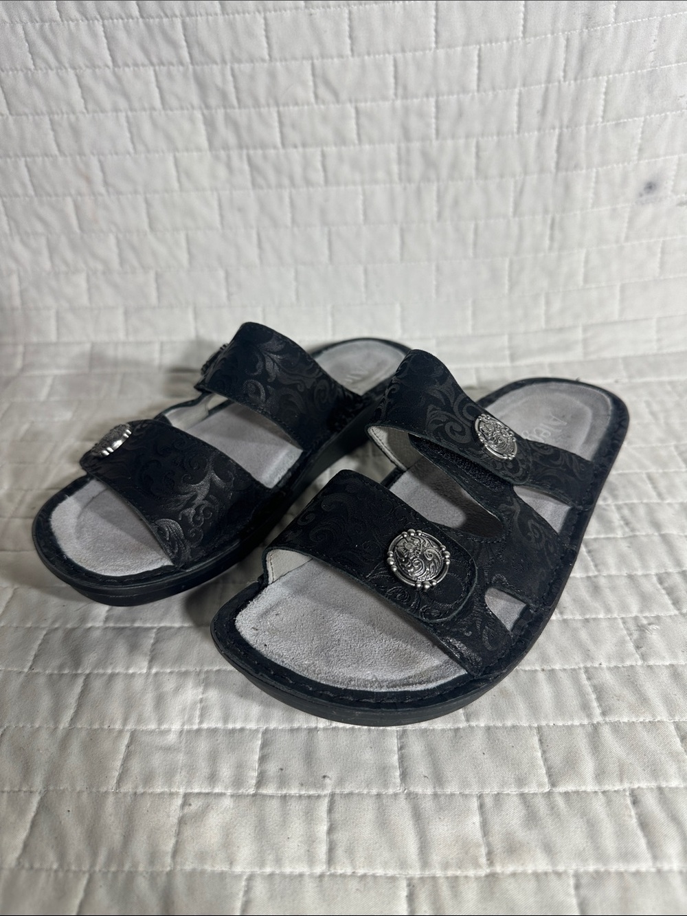 black embossed leather slide sandals from the Alegria Violette collection